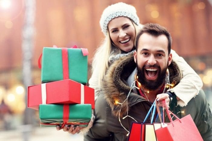 Couple holding presents Christmas